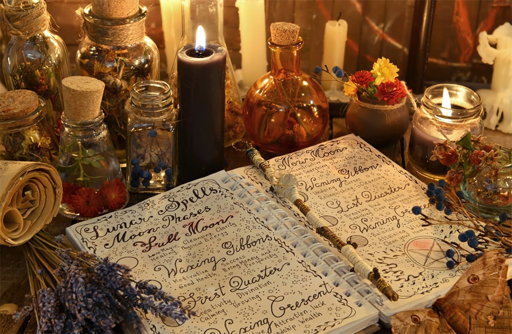 A book with the covers of alexandrian and gardnerian wicca traditions side by side